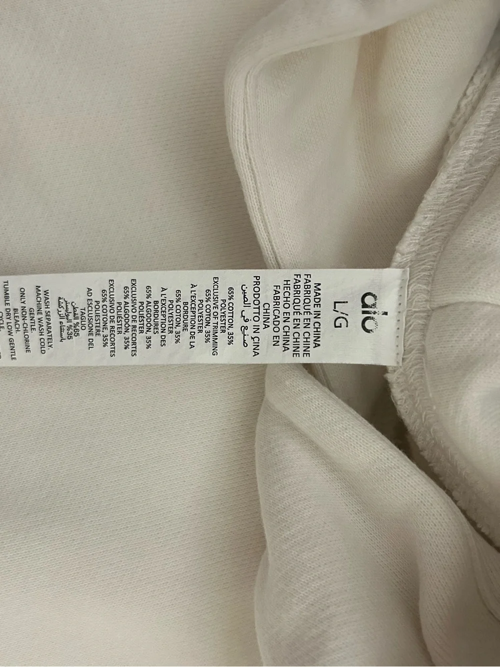 ALO Yoga Sleeveless Hooded Pullover in Light Cream